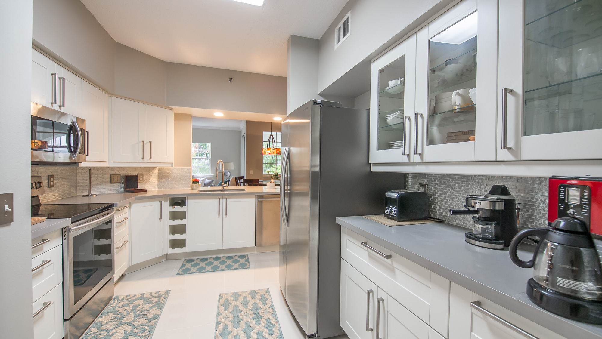 Contemporary IKEA kitchen featuring high-end appliances at Village By The Bay, Aventura, Florida