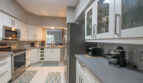 Well-equipped kitchen in a one-bedroom apartment with modern appliances at Village By The Bay, Aventura, Florida