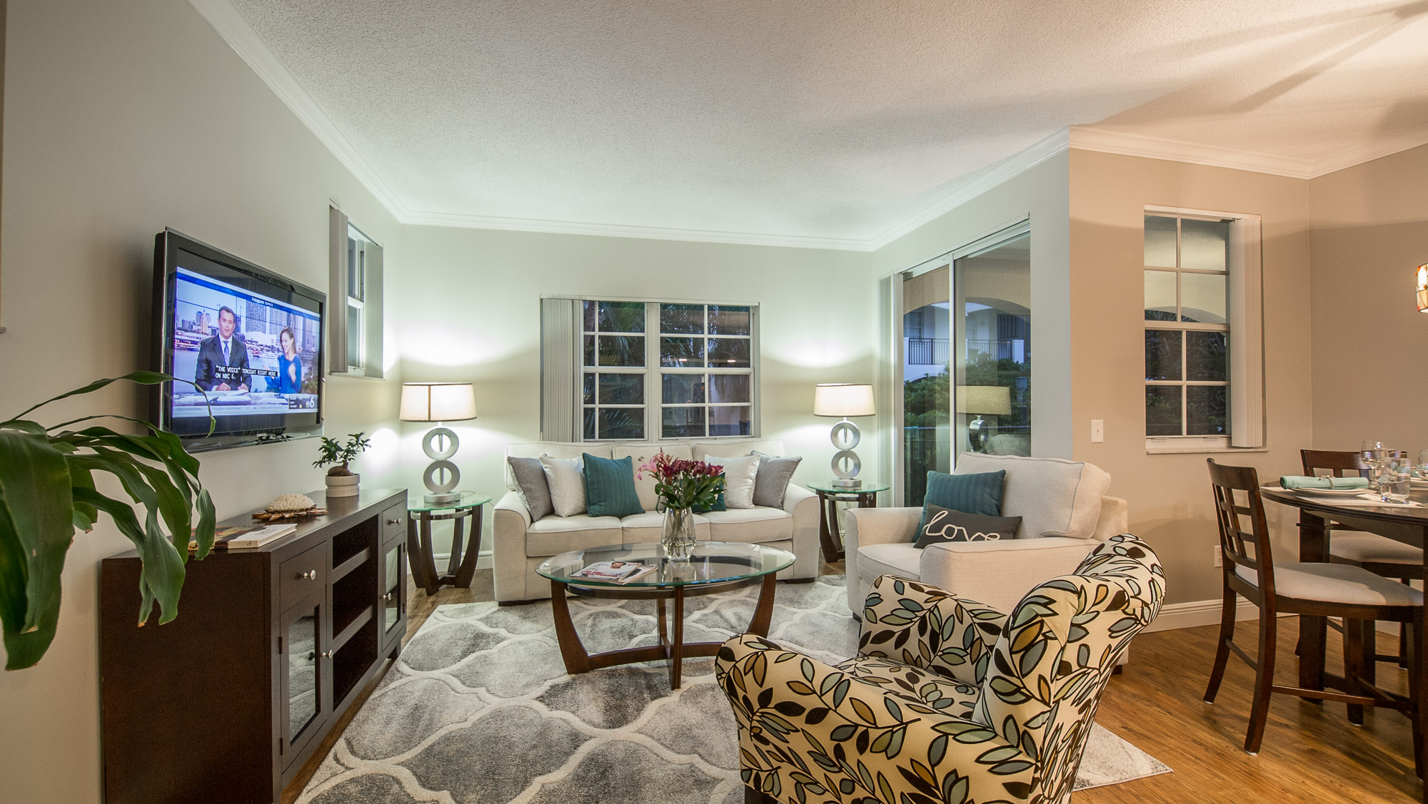 Living room of a one-bedroom apartment at Village By The Bay, Aventura, Florida