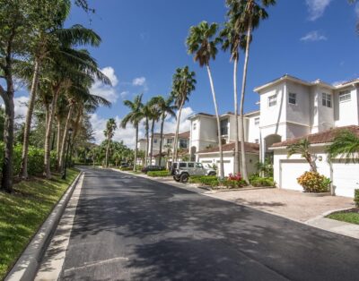 Main road leading into the Village By The Bay community in Aventura, Florid