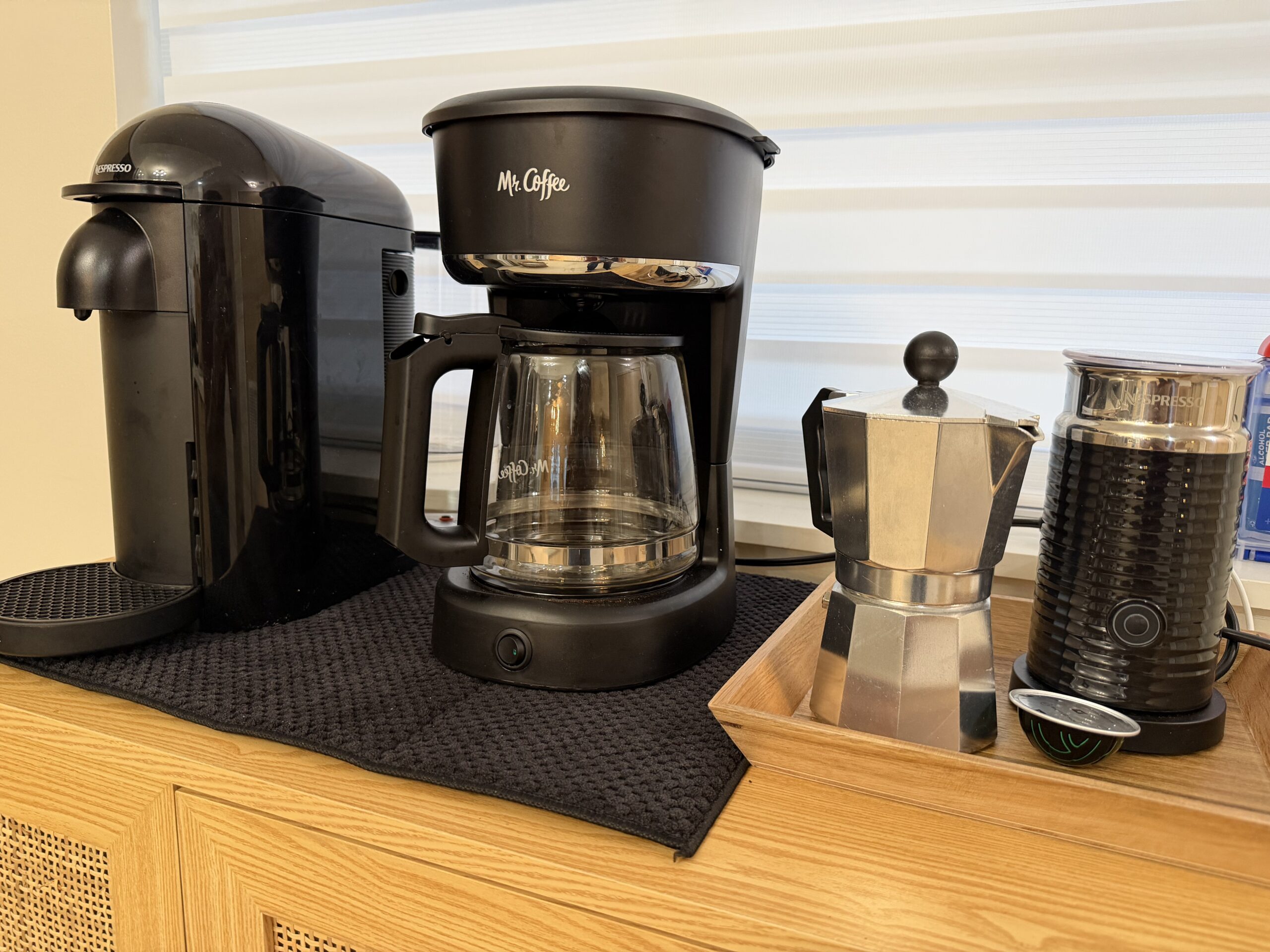 Espresso machine and coffee setup ready for guests in the two-bedroom apartment