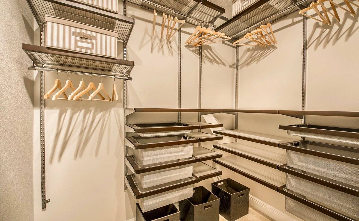 Walk-in closet with shelving, drawers, and hanging space sized for an extended stay
