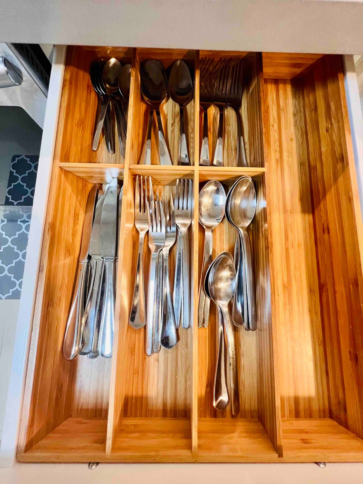 Bamboo cutlery organizer with full place settings for the Aventura extended-stay rental